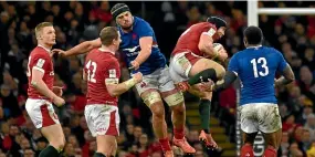  ??  ?? France No 8 Gregory Alldritt, centre, challenges Wales midfield back Hadleigh Parkes during their Six Nations match in Cardiff last month.