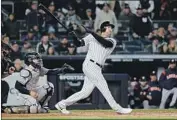  ?? Elsa Garrison Getty Images ?? AARON HICKS CONNECTS for a three-run homer off the right-field foul pole in the first inning.