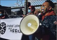  ?? Erik Trautmann / Hearst Connecticu­t Media ?? About 20 people gathered for a rally against Allen Fedor for claims of racially charged remarks on Tuesday outside his former body shop on Woodward Avenue in Norwalk.