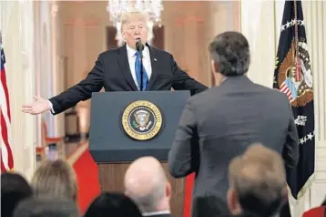  ?? EVAN VUCCI/AP ?? President Donald Trump answers a question from CNN journalist Jim Acosta during a news conference in the East Room.