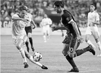  ?? JONATHAN DANIEL/GETTY IMAGES ?? Orlando City’s Kaká (right), playing for the MLS All-Stars, challenges Real Madrid’s Marcos Liorente on Wednesday.