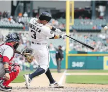  ?? LEON HALIP/GETTY IMAGES ?? Ian Kinsler of the Detroit Tigers hits a solo home run to left field during the sixth inning in a 2-1 victory over the Boston Red Sox on Monday at Comerica Park.