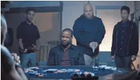  ?? WWE STUDIOS ?? Jacob Latimore (right) tries to keep one step ahead of a sinister thug played by Dulé Hill (center) in “Sleight.”