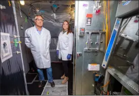  ?? PATRICK CAMPBELL — PROVIDED BY THE UNIVERSITY OF COLORADO ?? University of Colorado engineerin­g professor Mark Hernandez, left, and CU PH.D. graduate Marina Nieto-caballero stand inside a bioaerosol chamber used for the study.