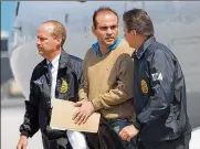  ?? ALAN DIAZ / ASSOCIATED PRESS 2008 ?? Colombian paramilita­rywarlord Salvatore Mancuso is escorted byU.S. DEA agents upon his arrival toOpa-locka, Florida, onMay 13, 2008.