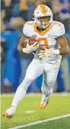  ?? THE ASSOCIATED PRESS ?? Tennessee running back Ty Chandler runs during the first half against Kentucky Saturday in Lexington, Ky. Chandler scored the Vols’ only two touchdowns in their 29-26 loss to the Wildcats.