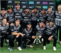  ?? AP ?? The New Zealand team pose for a photograph with the trophy after their win against India in the third and final T20 on Sunday. —