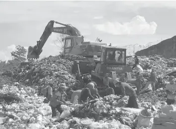  ??  ?? The Cebu City Government has set aside P52.4 million for the rehabilita­tion, closure and remediatio­n plan of the controvers­ial Inayawan landfill, which has been closed down for about eight months already.