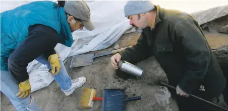  ??  ?? Left, Cherie Scheick, president of the Río Grande Foundation for Communicat­ions and Cultural Landscapes, and Patrick Brogan, staff archaeolog­ist, examine material from a sampling auger; above right, Scheick stands in an ancient room; top, a bone...