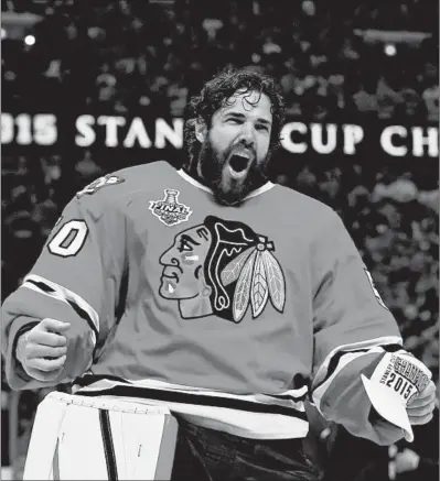  ?? BRIAN CASSELLA/CHICAGO TRIBUNE ?? Blackhawks goalie Corey Crawford celebrates in 2015 after defeating the Lightning in Game 6 of the Stanley Cup Final at the United Center.