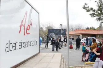  ?? Nikolas Samuels/The Signal (See additional photos at signalscv.com) ?? Parents pick up their kids from Albert Einstein STEAM Academy in Valencia on Friday. School leaders are unsure of the fate of Einstein Academy programs next year due to a lack of funds.