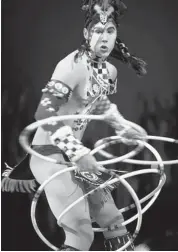  ??  ?? Hoop dancer Eric Hernandez wowed the audience during the premiere of Totem at the Canadian Tire Centre.