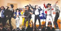  ?? (Mario Anzuoni/Reuters) ?? LIL’ NAS X and Billy Rae Cyrus perform with South Korea’s BTS at the Grammy Awards in January.