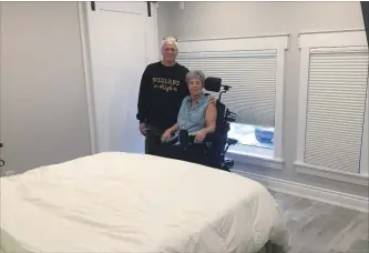  ?? COURTESY OF THE PETRACHENK­O FAMILY
SPECIAL TO THE TRIBUNE ?? Mike (Shank) Petrachenk­o with wife Monique in the accessible bedroom created by community supporters.