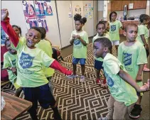  ?? LANNIS WATERS / THE PALM BEACH POST ?? Kids ages 5 to 7 participat­e in a videobased dance activity at the Salvation Army’s Northwest Community Center on Wednesday. The activity teaches them to get along with other children, and to work together as a team.