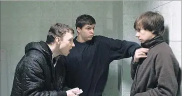  ?? Draf t house Fil ms ?? SERGEY ( GRIGORIY FESENKO)
and Shnyr ( Alexandr Sidelnikov) threaten a schoolmate in “The Tribe.”