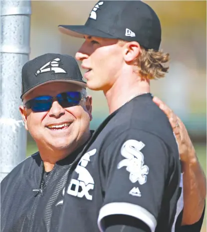  ??  ?? Manager Rick Renteria ( with pitching prospect Michael Kopech) says he thinks the White Sox have a bright future. | AP