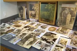  ?? The Associated Press ?? ■ A collection of photograph­s from the estate of mob boss Al Capone is seen on display at Witherell’s Auction House in Sacramento, Calif., on Wednesday.