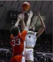  ?? Michael Conroy/Associated Press ?? Purdue forward Trey Kaufman-Renn shoots over Illinois forward Coleman Hawkins during the second half Friday in West Lafayette, Ind. Purdue defeated Illinois, 83-78.