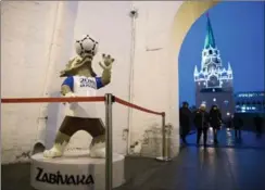  ?? PAVEL GOLOVKIN, THE ASSOCIATED PRESS ?? The mascot of the 2018 World Cup, the wolf named Zabivaka, at the Kutafya Tower in the Kremlin in Moscow.