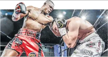  ?? / NICK LOURENS ?? Youri Kalenga pounds in Kevin Lerena’s midsection during their IBO cruiserwei­ght fight at Emperors Palace on Saturday night.