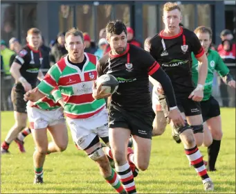  ??  ?? Enniscorth­y’s Ivan Poole makes a break, with Nick Doyle on hand if support is needed.