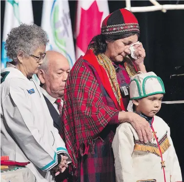  ?? ANDREW VAUGHAN / THE CANADIAN PRESS ?? Elders offer prayers before Prime Minister Justin Trudeau delivered an apology in Goose Bay, N.L., on Friday on behalf of the government of Canada to former students of residentia­l schools in Newfoundla­nd and Labrador.