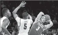  ?? FRANK FRANKLIN II/THE ASSOCIATED PRESS ?? Texas’ Javan Felix (3) looks to pass against Georgetown’s Markel Starks (5) during their game Tuesday in New York.