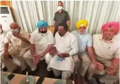  ??  ?? Punjab chief minister Amarinder Singh with party colleagues in Amritsar on Thursday.