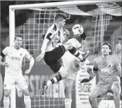  ?? Martin Meissner Associated Press ?? CHRISTIAN PULISIC, shown going airborne for the ball, is among U.S. players who thrived overseas.