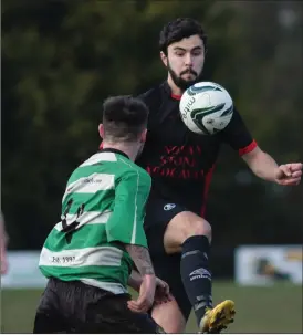  ??  ?? Daniel Murphy of Bridge Rovers controls the ball as John Kavanagh closes in.