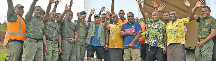  ?? Photo: DEPTFO News ?? Prime Minister Voreqe Bainimaram­a with members of the Republic of the Fiji Military Forces during relief efforts in the Northern Division.