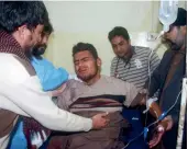  ??  ?? A Pakistani resident injured in a roadside bombing is being treated in Bannu on Tuesday.