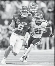  ?? NWA Democrat-Gazette/BEN GOFF • @NWABENGOFF ?? Arkansas quarterbac­k Ben Hicks runs for 17 yards against Texas A&M during the fourth quarter Saturday at AT&T Stadium in Arlington, Texas.