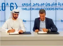  ?? Supplied photo ?? Omar Al Olama and Rabea Ataya sign the partnershi­p agreement to support the One Million Arab Coders initiative. —