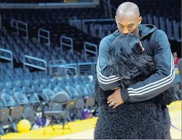  ?? Wally Skalij Los Angeles Times ?? LONG AFTER HIS FINAL GAME, Lakers star Kobe Bryant shares a moment with his wife Vanessa.