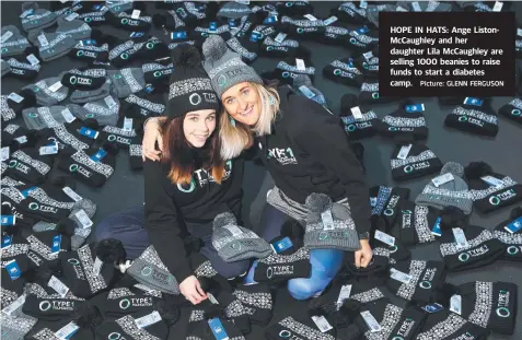  ?? Picture: GLENN FERGUSON ?? HOPE IN HATS: Ange ListonMcCa­ughley and her daughter Lila McCaughley are selling 1000 beanies to raise funds to start a diabetes camp.