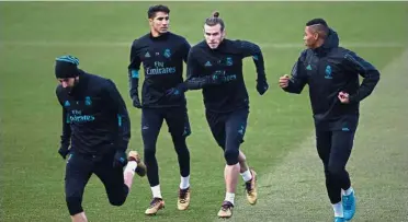  ?? — AP ?? Practice makes perfect: Real Madrid’s Gareth Bale (second from right) training with teammates in Madrid on Friday.