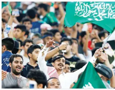  ??  ?? File photo shows ecstatic Saudi football fans during the Asian World Cup qualifying match between Japan and Saudi Arabia on Sept. 5. (Reuters)