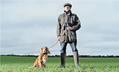  ?? ?? Gamekeeper Edward Coles surveys the damage done to fields in Cambridges­hire by hare coursers
