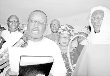  ??  ?? Bio (left) takes the oath of office as new president of Sierra Leone in Freetown. — AFP photo