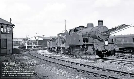  ?? MIKE FOX/RAIL ARCHIVE STEPHENSON ?? A powerful study of No. 30955 as it pilots ‘700’ 0-6-0 No. 30327 away from Exeter St David’s on August 5 1960. It’s hard to believe, given the bulky lines of the ‘Z’, that the boiler was based on an LBSCR 0-6-0. These were one of the few locomotive­s where the smokebox was of a smaller diameter than the boiler.