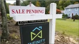  ?? CHARLES KRUPA — THE ASSOCIATED PRESS FILE ?? A residentia­l home for sale in East Derry, N.H. Sales of previously occupied U.S. homes slowed last month as rising prices and a dearth of homes for sale kept some would-be buyers on the sidelines.