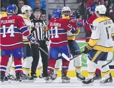  ?? MINAS PANAGIOTAK­IS/GETTY IMAGES ?? Nashville Predators defenceman P.K. Subban and Montreal Canadiens right wing Brendan Gallagher scuffle during Saturday night’s game in Montreal. The Predators won 3-2 in a shootout.