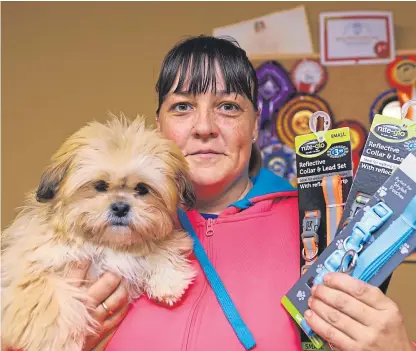  ?? Picture: Dougie Nicolson. ?? Nichola Mackay, of Langdyke Boarding Kennels, with Millie and some of the leads and collars that have been handed in to the Kennoway site.