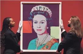  ?? TOBY MELVILLE/REUTERS ?? A colorful 1985 screenprin­t of Queen Elizabeth II by Andy Warhol is displayed for the “Royal Portraits: A Century of Photograph­y” exhibition at The King’s Gallery at Buckingham Palace in London.