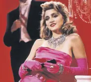  ?? ?? A still shot from “Material Girl” shows Madonna in the iconic pink dress.