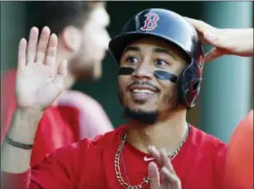  ?? MICHAEL DWYER — ASSOCIATED PRESS ?? The Red Sox’s Mookie Betts celebrates after scoring on a single by Brock Holt against the Blue Jays in Boston.