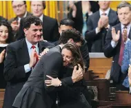  ?? SEAN KILPATRICK / THE CANADIAN PRESS ?? Prime Minister Justin Trudeau hugs Foreign Affairs Minister Chrystia Freeland after her speech in the House of Commons Tuesday, where she noted that Canada cannot “rely solely on the U.S. security umbrella.”