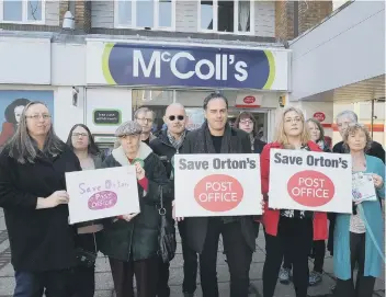  ??  ?? Cllr Julie Howell (front, second from right) demonstrat­ing previously against the loss of the Post Office